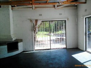 Wohnbereich mit Kamin des Ferienhauses